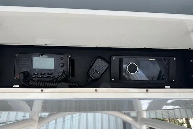 Slide: The Image of 2015 Jupiter 30 CC boat console with Garmin and Fusion electronics. - 12