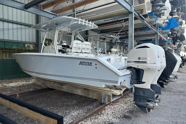 Slide: The Image of 2015 Jupiter 30 CC boat with Yamaha engines in storage facility. - 2