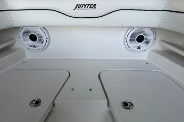 Slide: The Image of Interior of 2015 Jupiter 30 CC boat with speakers and storage compartments. - 5
