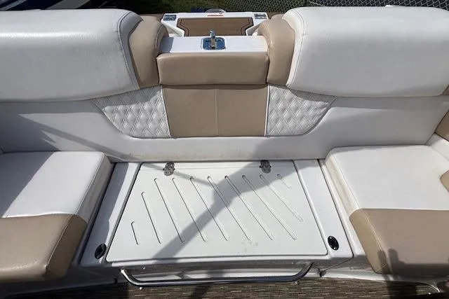 Slide: The Image of 2018 Glastron GT 187 boat interior with beige and white seating. - 18