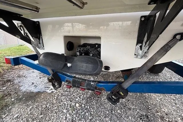 Slide: The Image of Rear view of 2018 Glastron GT 187 boat on trailer, showing hull and propeller area. - 31