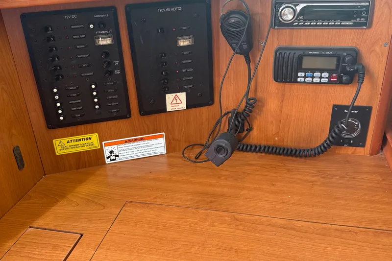 Slide: The Image of Control panel of a 2007 Hunter 31 sailboat with radio and electrical switches. - 10