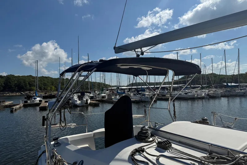 Slide: The Image of Sailboat docked in marina, Hunter 31 model, 2007, under clear blue sky. - 4
