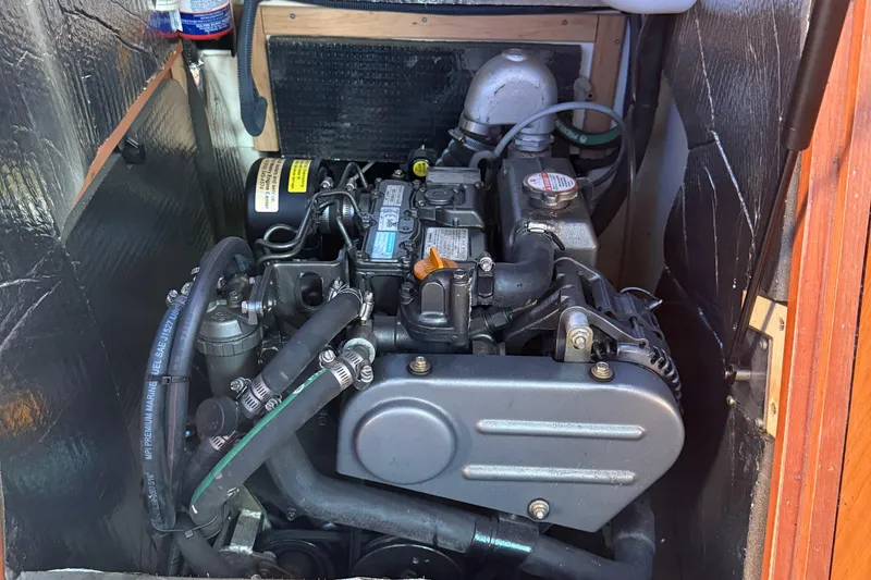 Slide: The Image of Engine compartment of a 2007 Hunter 31 sailboat, showcasing detailed mechanical components. - 7