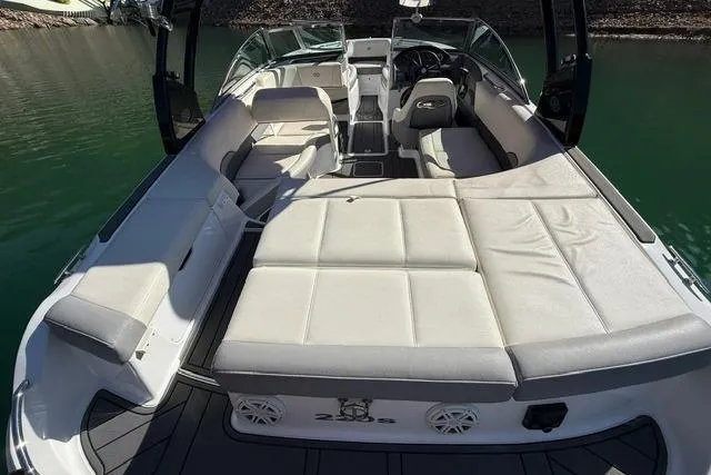 Slide: The Image of 2017 Cobalt 220S boat interior with spacious seating and modern design on the water. - 11