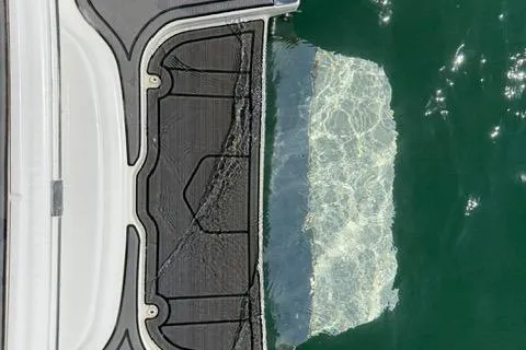 Slide: The Image of Cobalt 220S 2017 boat deck with water reflection, close-up view. - 13