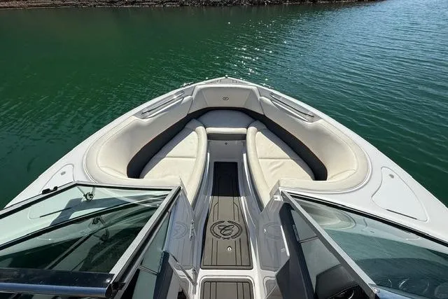 Slide: The Image of 2017 Cobalt 220S boat with open bow seating on calm water. - 4