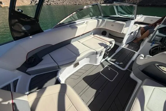 Slide: The Image of 2017 Cobalt 220S boat interior with spacious seating and modern design on a sunny day. - 6