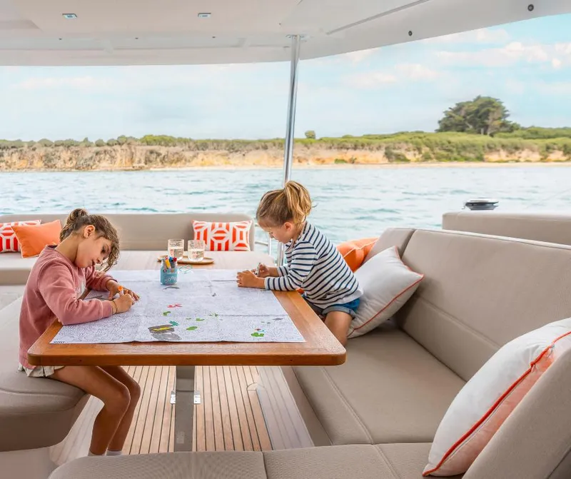 Slide: The Image of Children coloring on Fountaine Pajot NEW 41 yacht, 2025 model, with scenic ocean view. - 29