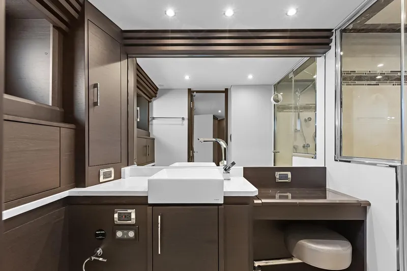 Slide: The Image of Luxurious bathroom interior of 2016 Marquis 720 Fly Bridge yacht, featuring modern fixtures and elegant design. - 32