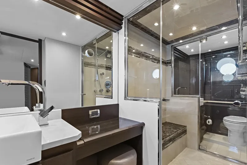 Slide: The Image of Luxurious bathroom in 2016 Marquis 720 Fly Bridge yacht with modern fixtures and elegant design. - 33