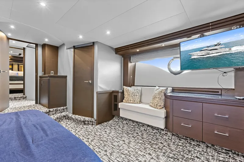 Slide: The Image of Luxurious interior of 2016 Marquis 720 Fly Bridge yacht with modern furnishings and TV. - 36