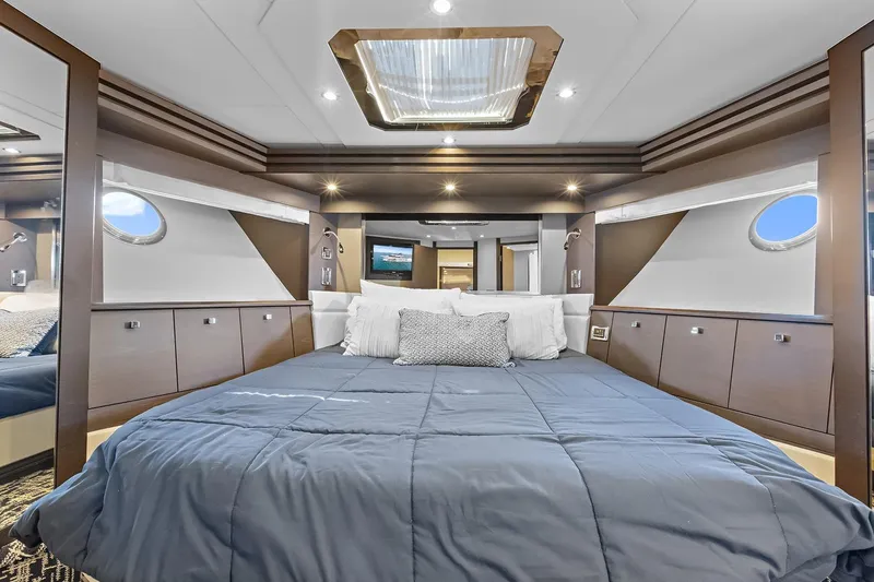 Slide: The Image of VIP bedroom interior of 2016 Marquis 720 Fly Bridge offers queen sized bed and private bathroom - 39