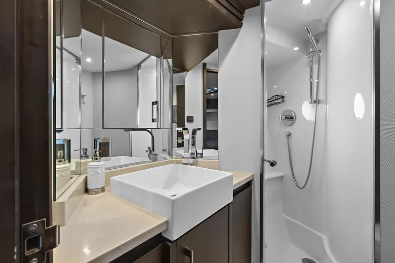 Slide: The Image of Luxurious VIP suite bathroom in 2016 Marquis 720 Fly Bridge yacht with modern fixtures. - 42