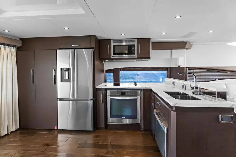 Slide: The Image of Luxurious kitchen interior of 2016 Marquis 720 Fly Bridge yacht with modern appliances. - 44