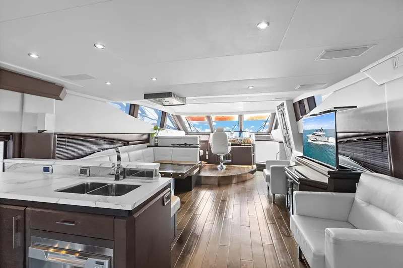 Slide: The Image of Luxurious interior of 2016 Marquis 720 Fly Bridge yacht with modern furnishings and panoramic windows. - 46