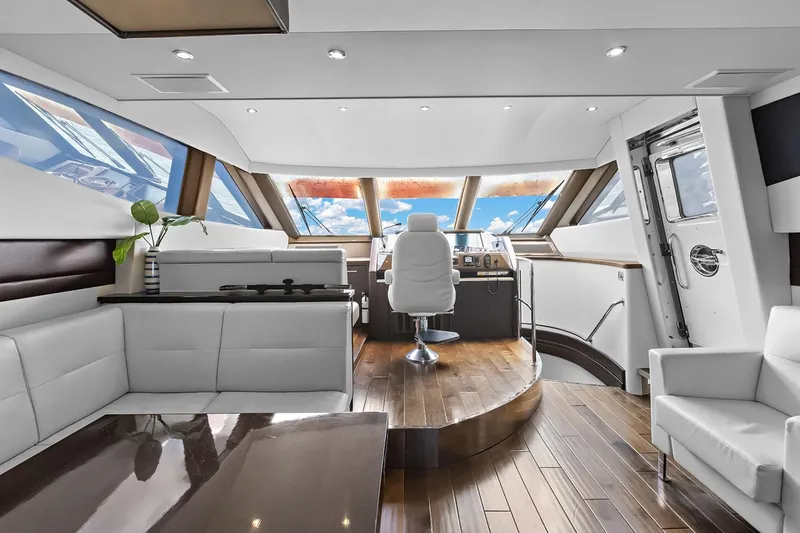 Slide: The Image of Luxurious 2016 Marquis 720 Fly Bridge yacht interior with modern helm and seating area. - 52