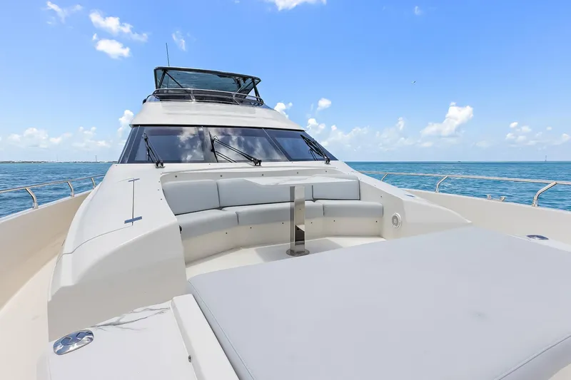 Slide: The Image of Luxury Marquis 720 Fly Bridge yacht, 2016 model, cruising on a clear blue ocean. - 55