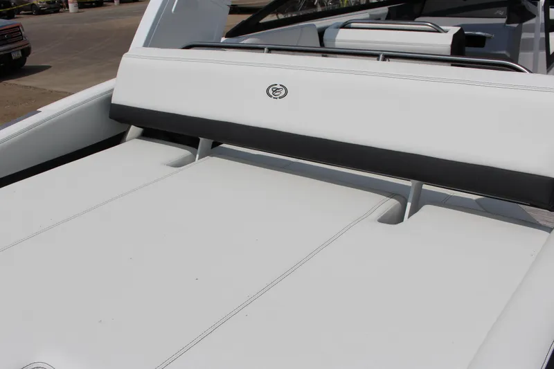 Slide: The Image of 2025 Cobalt R4 boat interior with sleek white seating and modern design. - 12