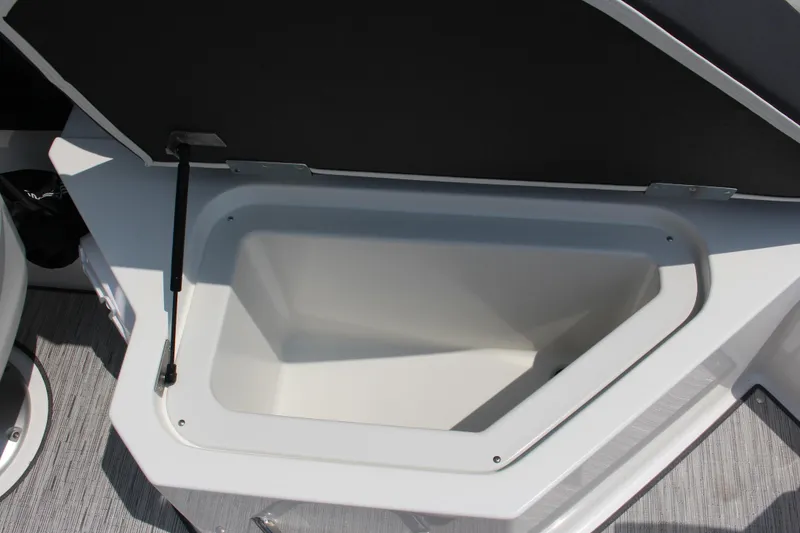 Slide: The Image of Open storage compartment in 2025 Cobalt R4 boat, featuring sleek design and ample space. - 14