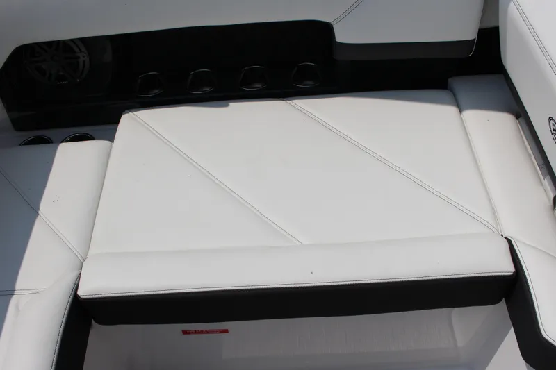 Slide: The Image of White leather seating on 2025 Cobalt R4 boat, featuring sleek design and cup holders. - 16