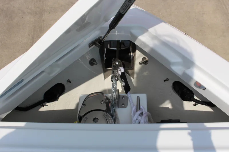 Slide: The Image of Anchor compartment of 2025 Cobalt R4 boat with winch and rope. - 22