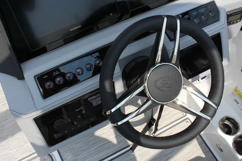 Slide: The Image of Steering wheel and dashboard of 2025 Cobalt R4 boat with Garmin display. - 23