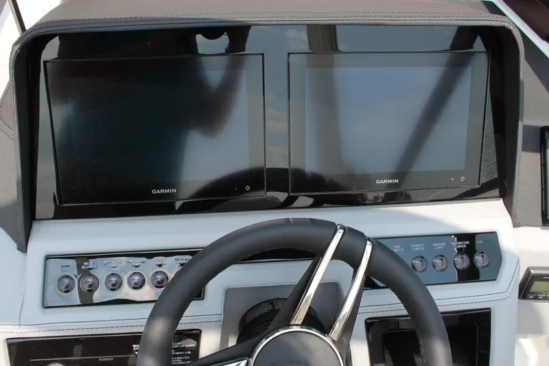 Slide: The Image of 2025 Cobalt R4 dashboard with dual Garmin screens and control panel. - 24