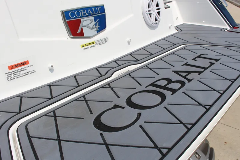 Slide: The Image of 2025 Cobalt R4 boat deck with logo and safety warnings. - 9