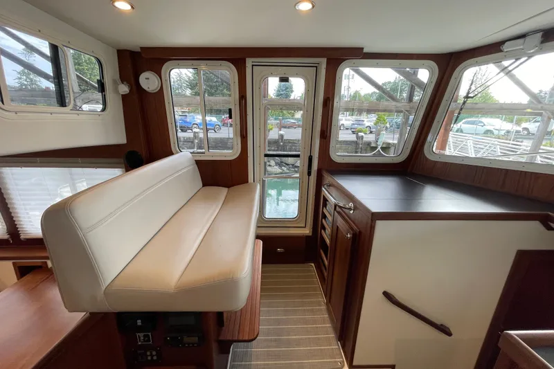 Slide: The Image of Interior of 2022 American Tug 362 with seating and large windows. - 18