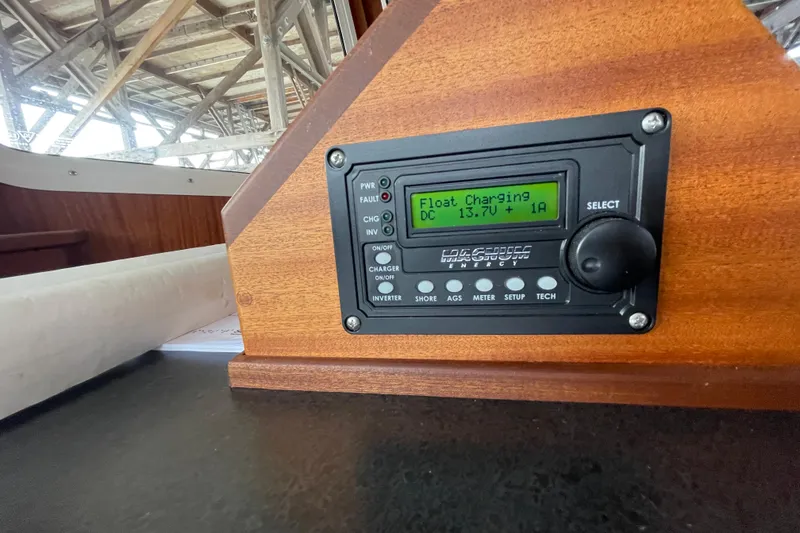 Slide: The Image of Control panel on 2022 American Tug 362 displaying float charging status. - 26