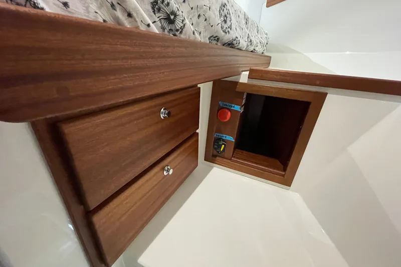 Slide: The Image of Interior of 2022 American Tug 362 featuring wooden drawers and a small compartment. - 34