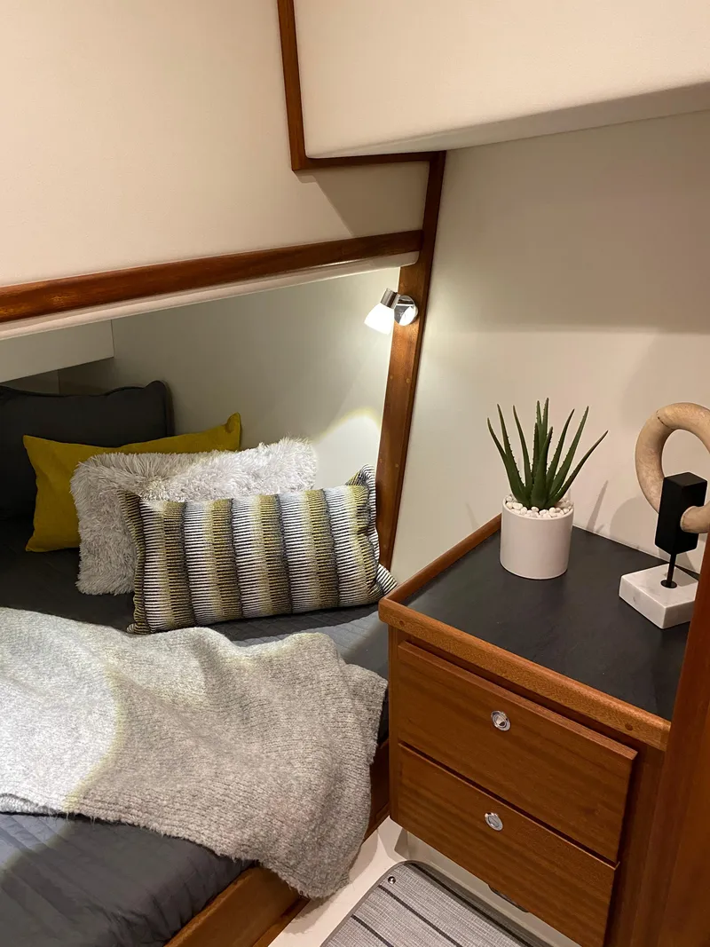 Slide: The Image of Cozy bedroom in 2025 American Tug 362 with modern decor and wooden accents. - 39