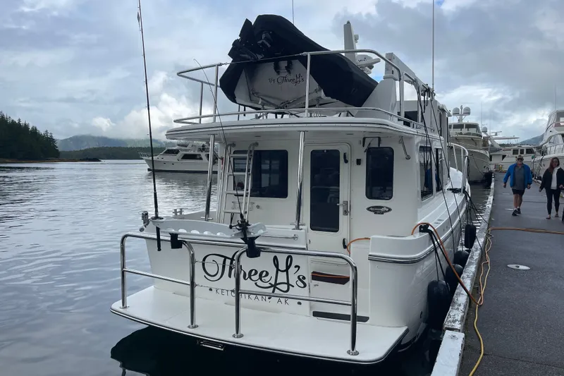 Slide: The Image of American Tug 362, 2022 model, docked in Ketchikan, Alaska, with overcast skies. - 4