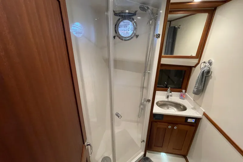 Slide: The Image of Bathroom interior of 2022 American Tug 362 with shower and sink. - 48