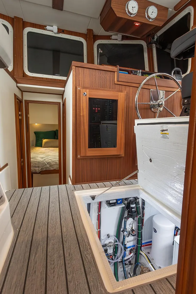Slide: The Image of Interior of 2026 American Tug 362, showcasing cabin and engine access. - 49