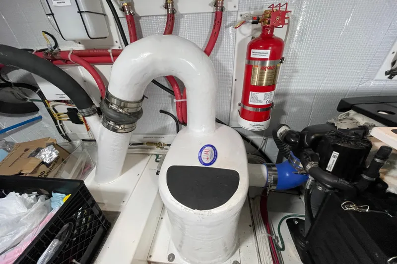 Slide: The Image of Engine room of 2022 American Tug 362 with fire extinguisher and ventilation system. - 54