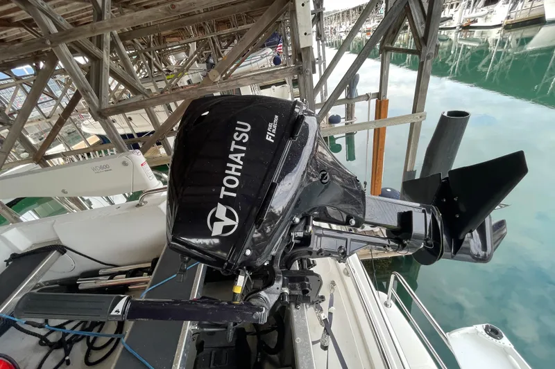 Slide: The Image of Tohatsu outboard motor on 2022 American Tug 362, docked in a marina. - 59
