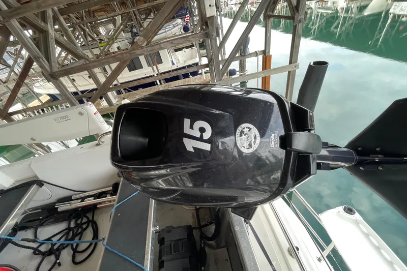Slide: The Image of Outboard motor on 2022 American Tug 362, docked in a marina. - 60