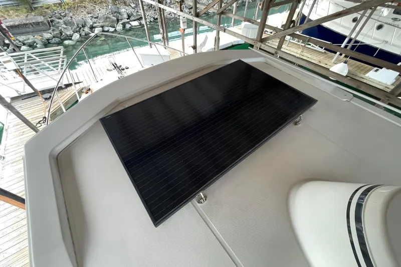 Slide: The Image of Solar panel on 2022 American Tug 362 boat deck, docked near water. - 62