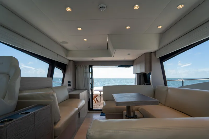 Slide: The Image of Luxurious interior of 2022 Ferretti Yachts 500 with ocean view through large windows. - 30