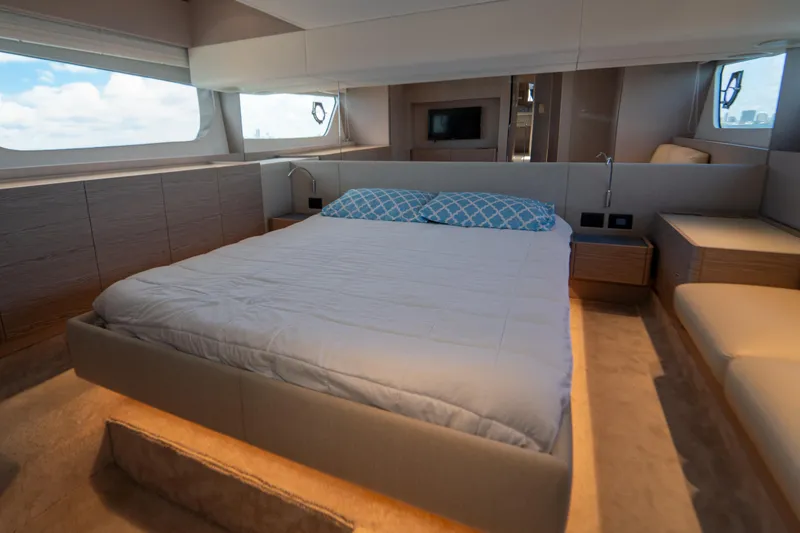 Slide: The Image of Luxurious bedroom interior of 2022 Ferretti Yachts 500 with modern design and large windows. - 35