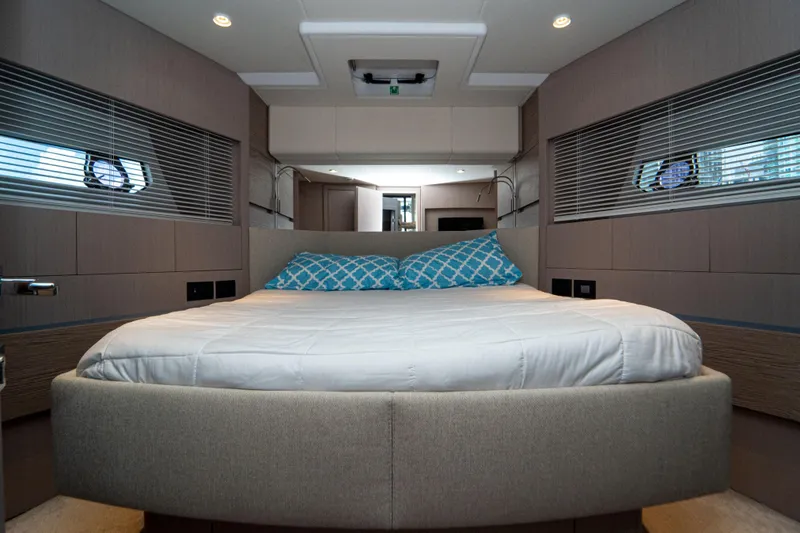 Slide: The Image of Luxurious bedroom interior of 2022 Ferretti Yachts 500 with modern design and cozy bedding. - 36