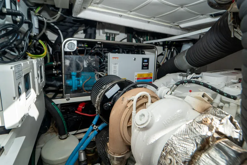 Slide: The Image of Engine room of 2022 Ferretti Yachts 500, showcasing mechanical components and wiring. - 56
