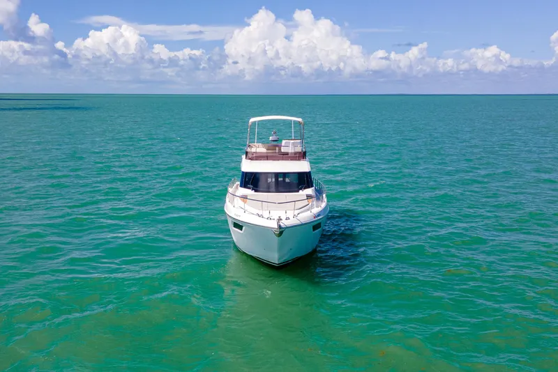 Slide: The Image of 2022 Ferretti Yachts 500 on turquoise ocean under blue sky. - 10