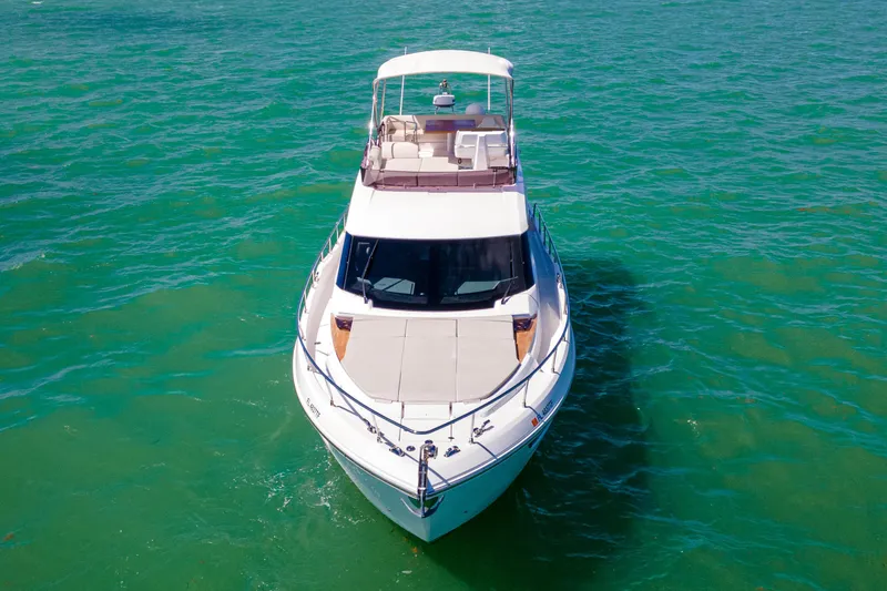 Slide: The Image of 2022 Ferretti Yachts 500 cruising on clear turquoise waters. - 11