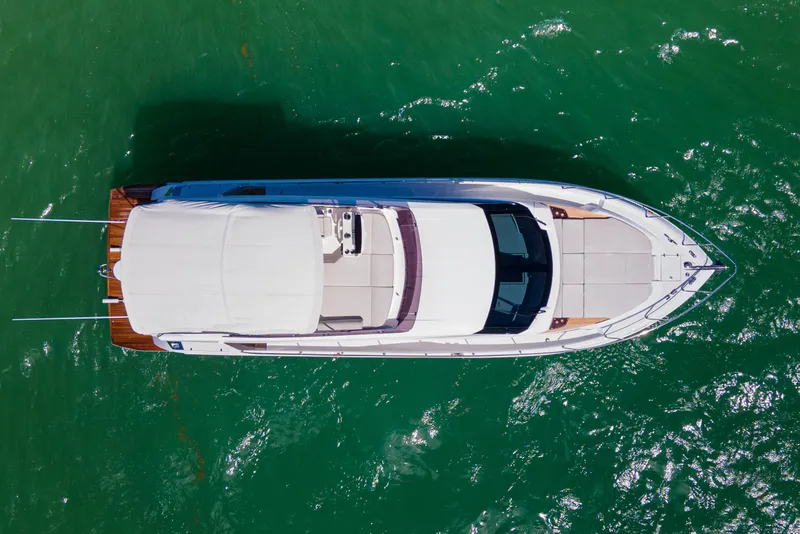 Slide: The Image of Aerial view of 2022 Ferretti Yachts 500 on vibrant green water. - 12
