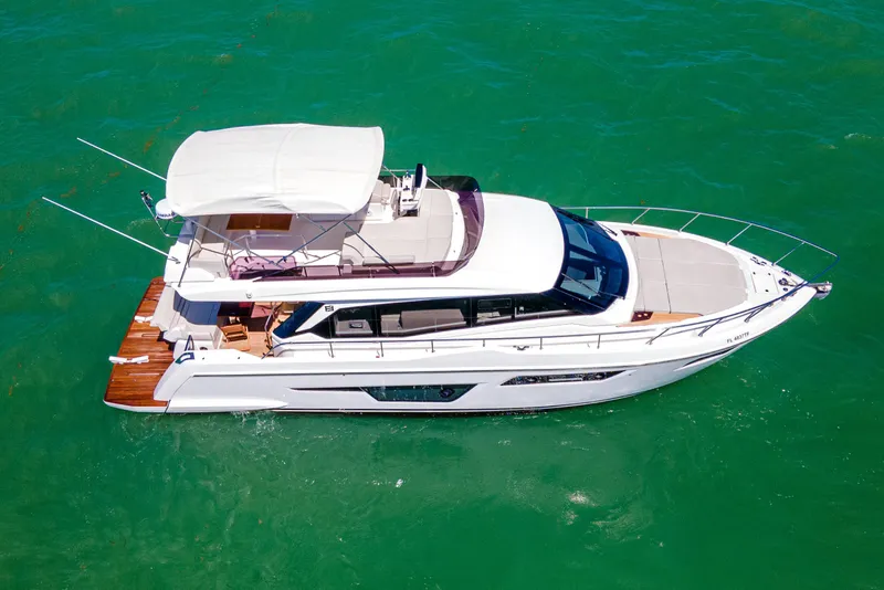 Slide: The Image of 2022 Ferretti Yachts 500 cruising on clear turquoise waters. - 13