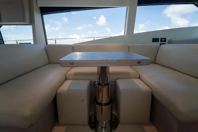 Slide: The Image of Luxurious interior of 2022 Ferretti Yachts 500 with elegant seating and table. - 27