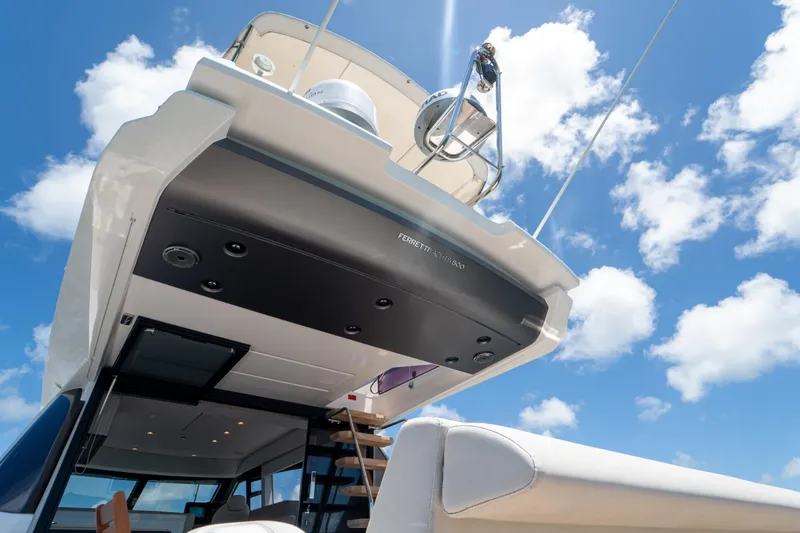Slide: The Image of 2022 Ferretti Yachts 500, luxury yacht exterior against a bright blue sky. - 42